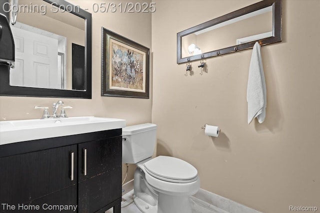 5182 Shady Creek Dr, Troy, MI 48085 - half bath with baseboards, toilet, vanity, and tile patterned floors