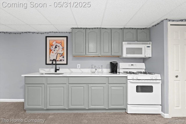5182 Shady Creek Dr, Troy, MI 48085 - kitchen with white appliances, a sink, a drop ceiling, gray cabinetry, and carpet flooring