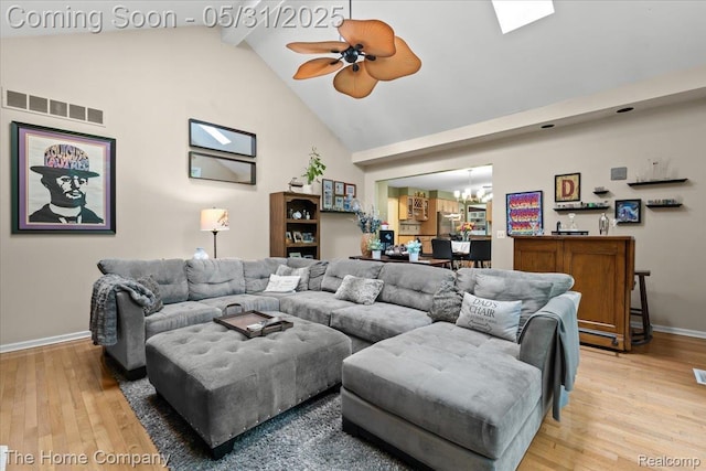 5182 Shady Creek Dr, Troy, MI 48085 - living room with baseboards, light wood-style flooring, a chandelier, beamed ceiling, and high vaulted ceiling