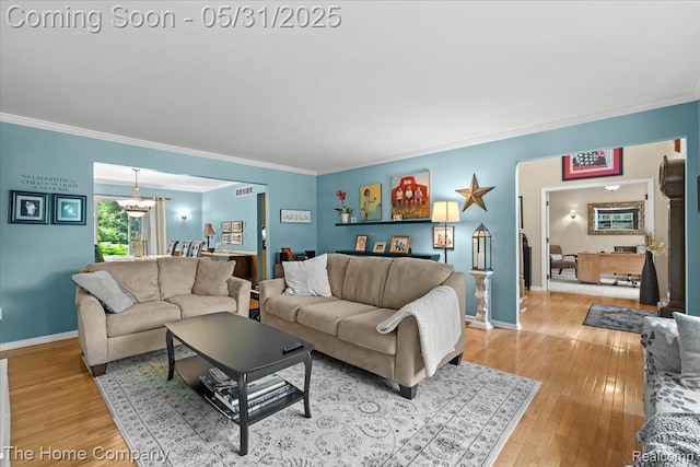 5182 Shady Creek Dr, Troy, MI 48085 - living area featuring ornamental molding, light wood-style floors, baseboards, and a chandelier