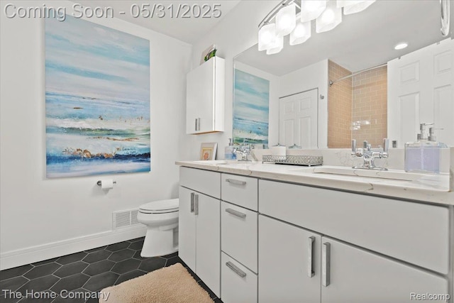 5182 Shady Creek Dr, Troy, MI 48085 - bathroom with double vanity, tile patterned floors, toilet, baseboards, and a shower