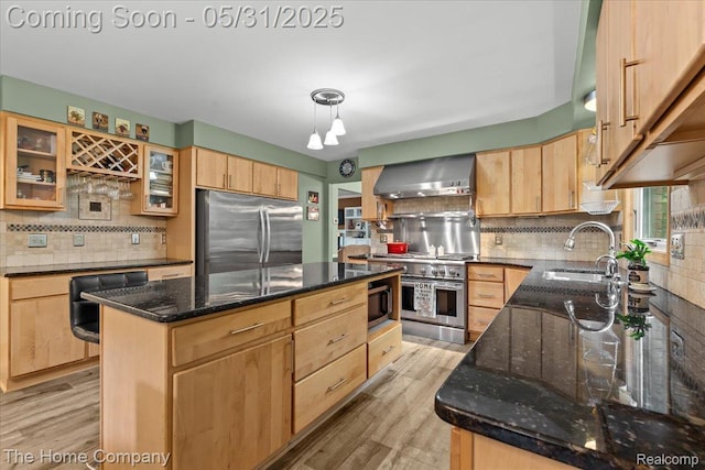 5182 Shady Creek Dr, Troy, MI 48085 - kitchen featuring appliances with stainless steel finishes, wall chimney range hood, a sink, and light brown cabinets