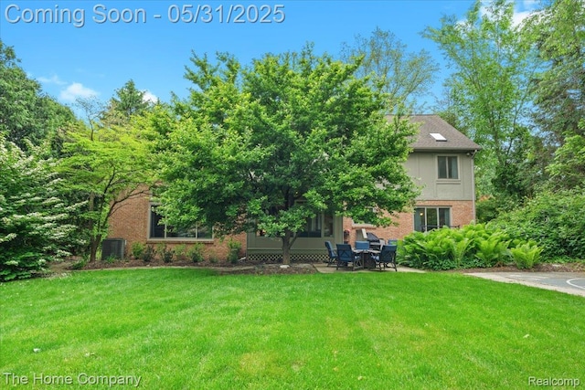 5182 Shady Creek Dr, Troy, MI 48085 - view of property hidden behind natural elements with brick siding, a front lawn, and a patio area