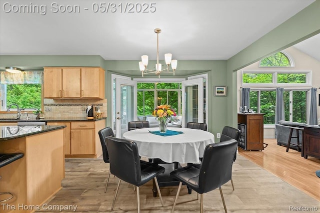 5182 Shady Creek Dr, Troy, MI 48085 - dining area featuring a chandelier and light wood-style floors