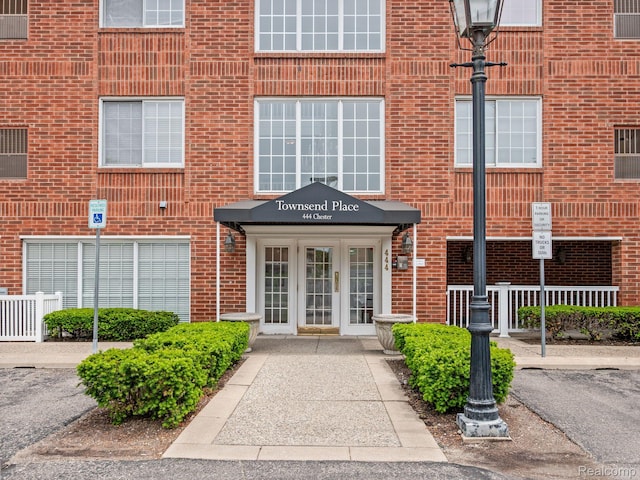 444 Chester St Unit 425, Birmingham, MI 48009 - view of exterior entry featuring brick siding