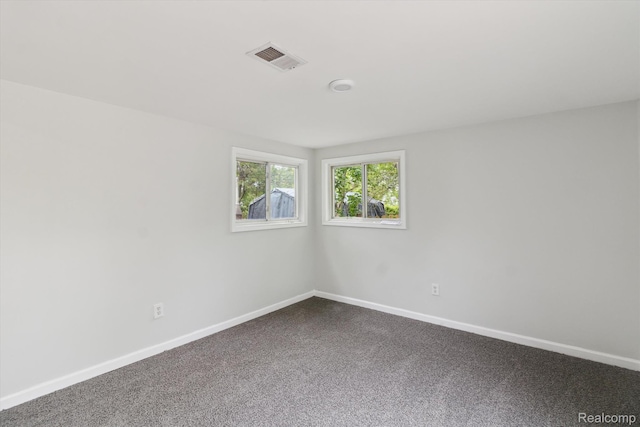 14134 Syracuse St, Southgate, MI 48180 - empty room with dark carpet and baseboards