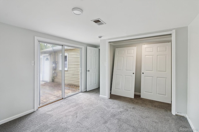 14134 Syracuse St, Southgate, MI 48180 - unfurnished bedroom with carpet, baseboards, and access to outside