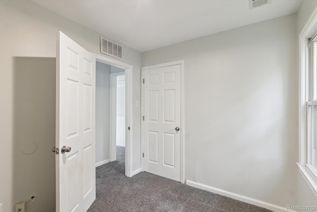 14134 Syracuse St, Southgate, MI 48180 - unfurnished bedroom featuring dark carpet and baseboards