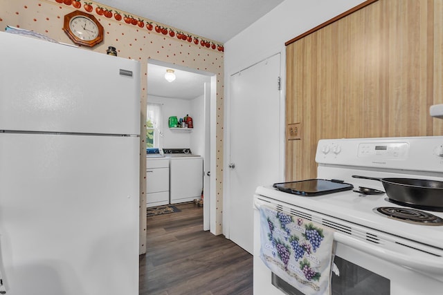 547 Pershing Ave, Jackson, MI 49203 - kitchen featuring white appliances, dark wood-style flooring, and washing machine and clothes dryer