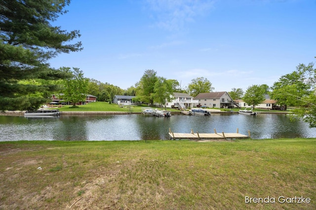 17055 Blackfoot Trl, Howard City, MI 49329 - water view with a dock and nearby suburban area