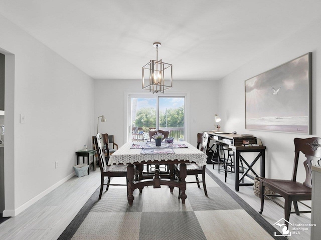 11963 Egan Hwy, Brooklyn, MI 49230 - dining area featuring wood finished floors and a chandelier