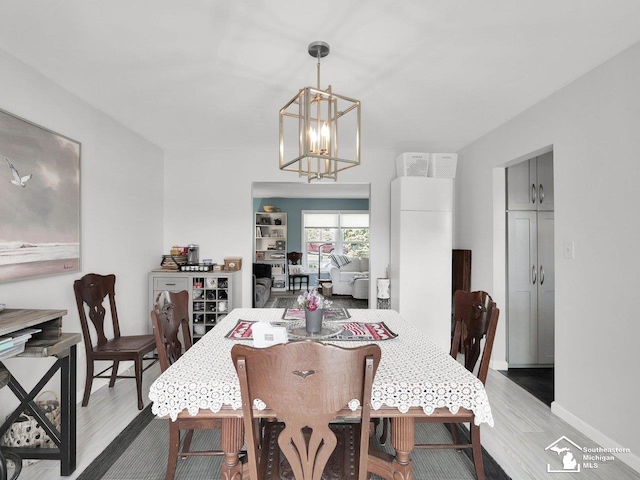 11963 Egan Hwy, Brooklyn, MI 49230 - dining room with a chandelier and wood finished floors