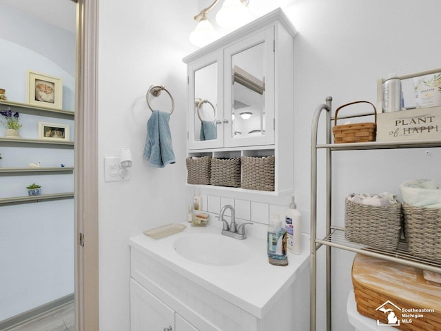 11963 Egan Hwy, Brooklyn, MI 49230 - bathroom with decorative backsplash and vanity