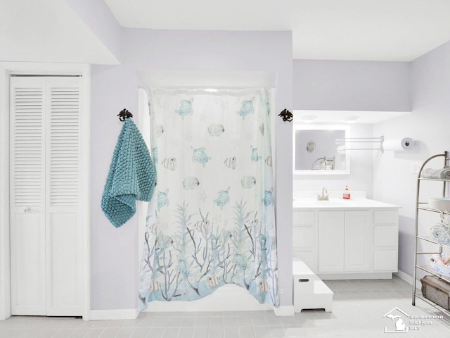 11963 Egan Hwy, Brooklyn, MI 49230 - bathroom featuring a closet, vanity, curtained shower, and tile patterned flooring