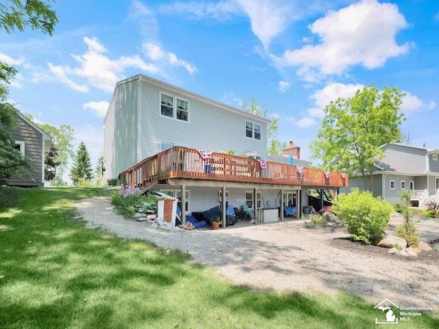 11963 Egan Hwy, Brooklyn, MI 49230 - back of property with a deck, a yard, and stairway