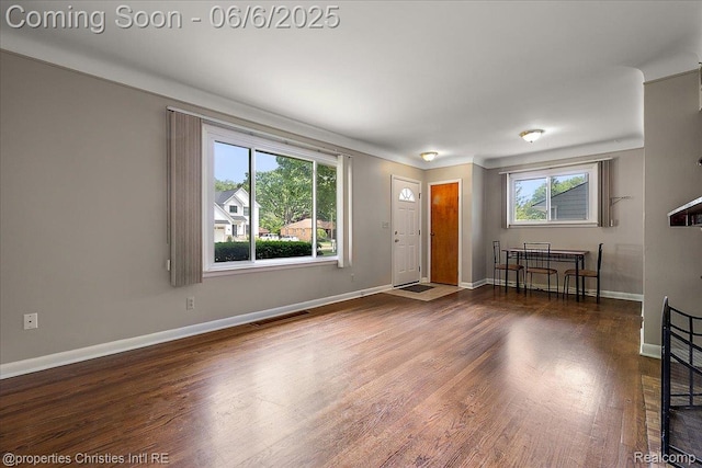 15501 Portis St, Northville, MI 48170 - unfurnished living room with wood finished floors and baseboards