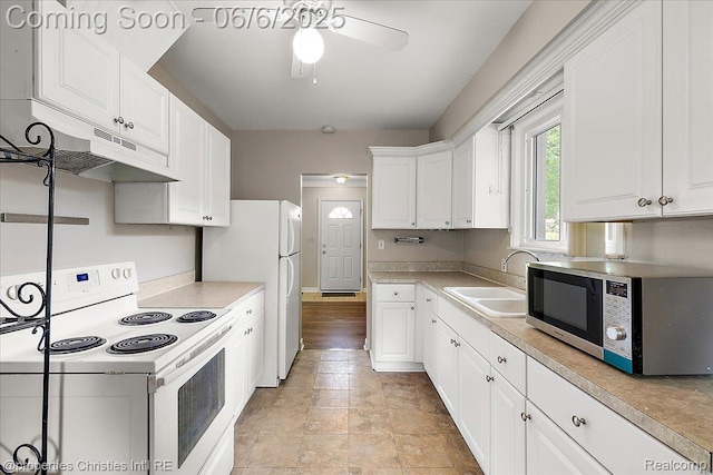 15501 Portis St, Northville, MI 48170 - kitchen featuring white appliances, under cabinet range hood, a sink, ceiling fan, and white cabinets