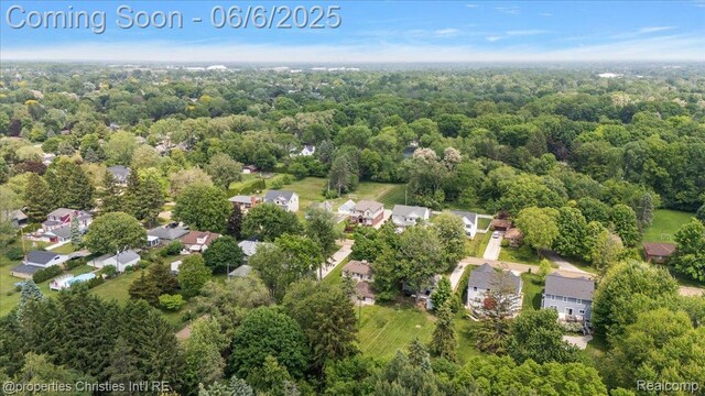 15501 Portis St, Northville, MI 48170 - aerial view of residential area with a forest