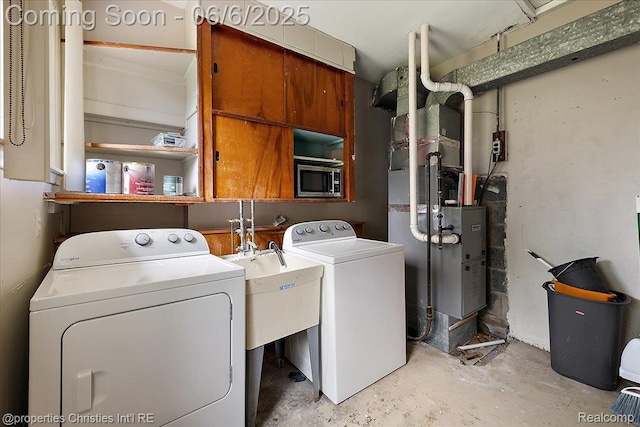 15501 Portis St, Northville, MI 48170 - laundry area featuring independent washer and dryer and cabinet space