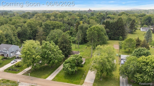 15501 Portis St, Northville, MI 48170 - aerial overview of property's location with a heavily wooded area