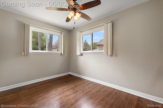 15501 Portis St, Northville, MI 48170 - empty room with plenty of natural light, baseboards, dark wood-type flooring, and ceiling fan