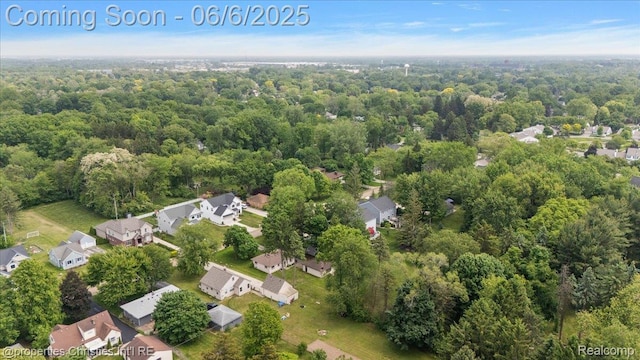 15501 Portis St, Northville, MI 48170 - aerial view of property and surrounding area featuring a forest and nearby suburban area