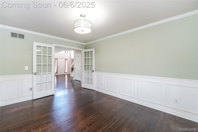 42105 Dorchester Ct, Clinton Township, MI 48038 - empty room featuring french doors, crown molding, dark wood-style floors, wainscoting, and a decorative wall