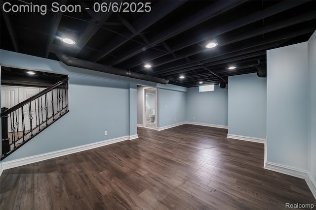 42105 Dorchester Ct, Clinton Township, MI 48038 - below grade area featuring stairs, baseboards, and wood finished floors