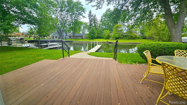 11940 Portage Lake Ave, Pinckney, MI 48169 - wooden terrace with a water view, a dock, a lawn, and boat lift