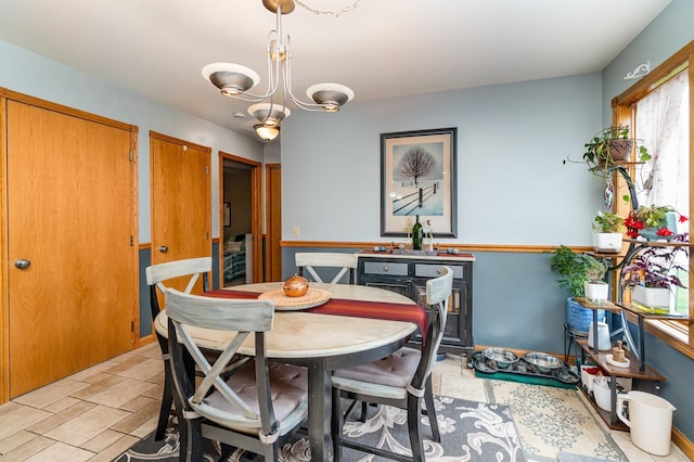 424 Gale Ct, Ithaca, MI 48847 - dining area with a chandelier