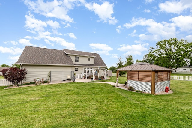 424 Gale Ct, Ithaca, MI 48847 - rear view of house featuring a gazebo, a patio area, and a shingled roof