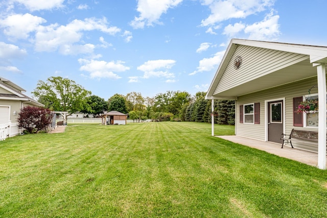 424 Gale Ct, Ithaca, MI 48847 - view of green lawn featuring a patio
