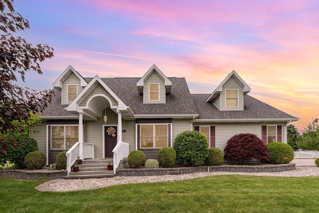 424 Gale Ct, Ithaca, MI 48847 - new england style home featuring a front yard and roof with shingles