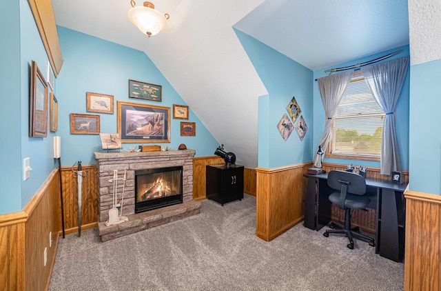 424 Gale Ct, Ithaca, MI 48847 - home office featuring wainscoting, carpet, vaulted ceiling, wooden walls, and a fireplace