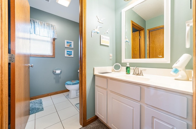 424 Gale Ct, Ithaca, MI 48847 - bathroom with vanity, toilet, tile patterned floors, and baseboards