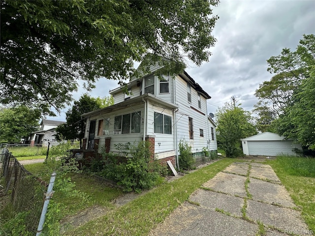 17184 Mackay St, Detroit, MI 48212 - view of front of home featuring a garage and an outbuilding