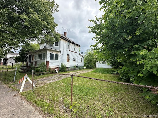 17184 Mackay St, Detroit, MI 48212 - view of front facade featuring a chimney