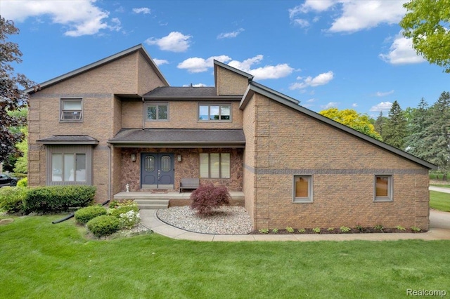 61381 Miriam Dr, Washington, MI 48094 - rear view of house featuring a lawn and brick siding