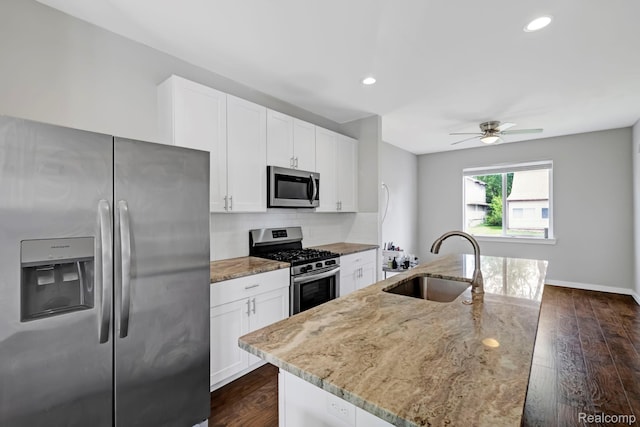 534 E Brickley Ave, Hazel Park, MI 48030 - kitchen featuring appliances with stainless steel finishes, a sink, tasteful backsplash, light stone countertops, and dark wood finished floors