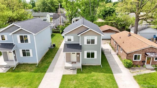 534 E Brickley Ave, Hazel Park, MI 48030 - aerial perspective of suburban area with a tree filled landscape