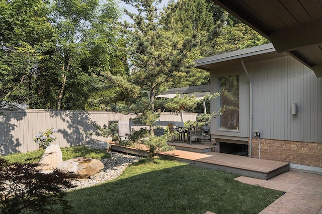35 Fultonwood Dr SE, Grand Rapids, MI 49503 - view of yard with a wooden deck