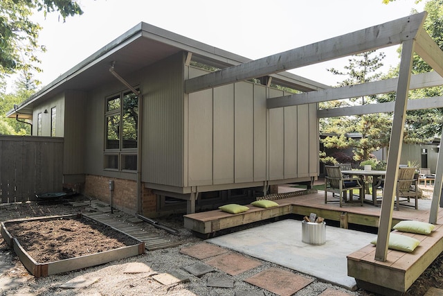 35 Fultonwood Dr SE, Grand Rapids, MI 49503 - view of property exterior with a garden, outdoor dining area, and a patio area