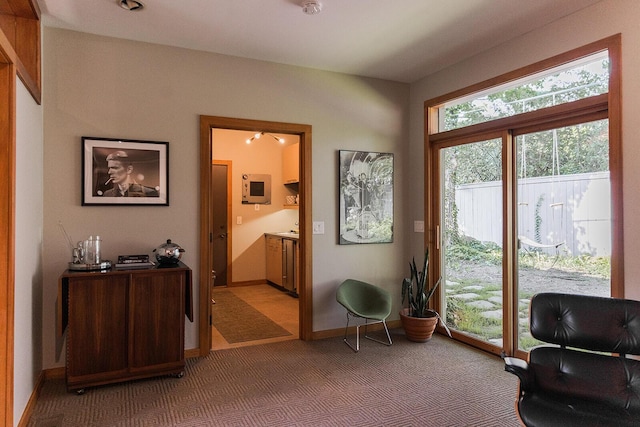 35 Fultonwood Dr SE, Grand Rapids, MI 49503 - living area featuring light carpet and baseboards