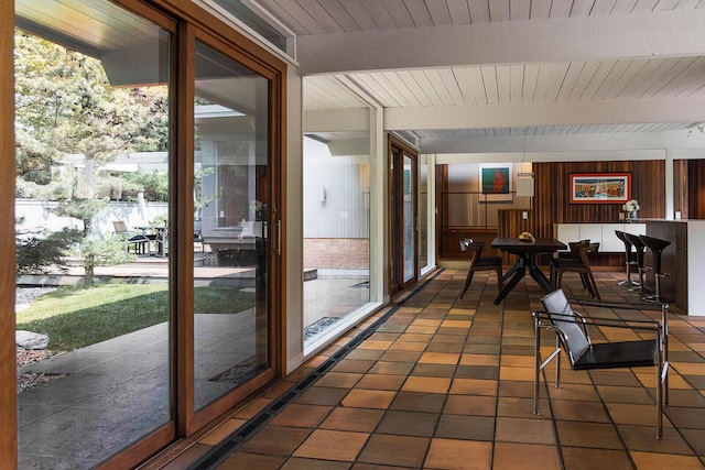 35 Fultonwood Dr SE, Grand Rapids, MI 49503 - sunroom featuring beamed ceiling