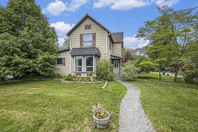 351 E Cherry St, Fremont, MI 49412 - view of front of home with a front lawn