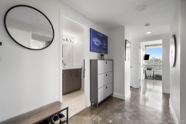 3320 Spinnaker Ln Unit 4A, Detroit, MI 48207 - hall with baseboards and finished concrete flooring