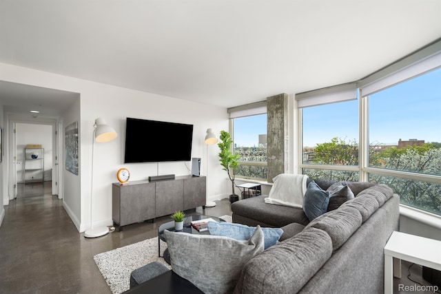 3320 Spinnaker Ln Unit 4A, Detroit, MI 48207 - living area with baseboards, concrete floors, and plenty of natural light