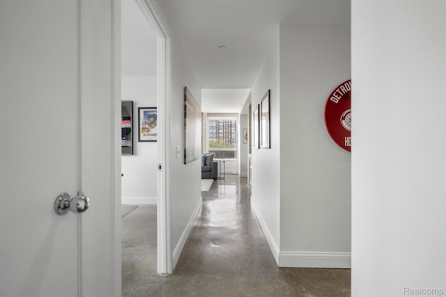 3320 Spinnaker Ln Unit 4A, Detroit, MI 48207 - hallway with concrete flooring and baseboards