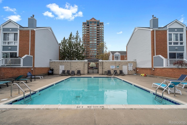 3320 Spinnaker Ln Unit 4A, Detroit, MI 48207 - community pool with a patio area