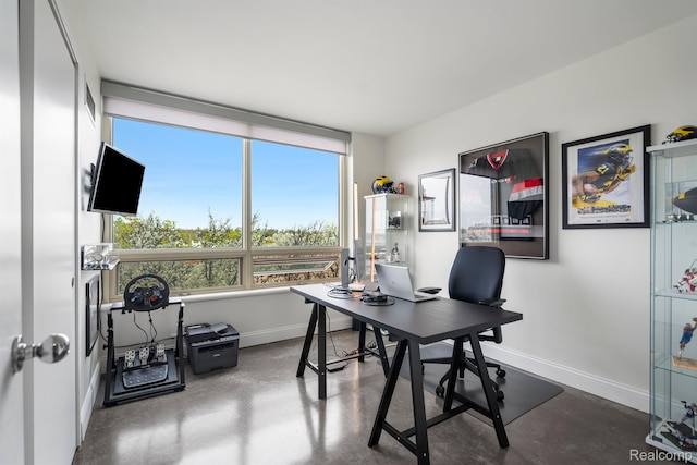 3320 Spinnaker Ln Unit 4A, Detroit, MI 48207 - home office featuring concrete floors and baseboards